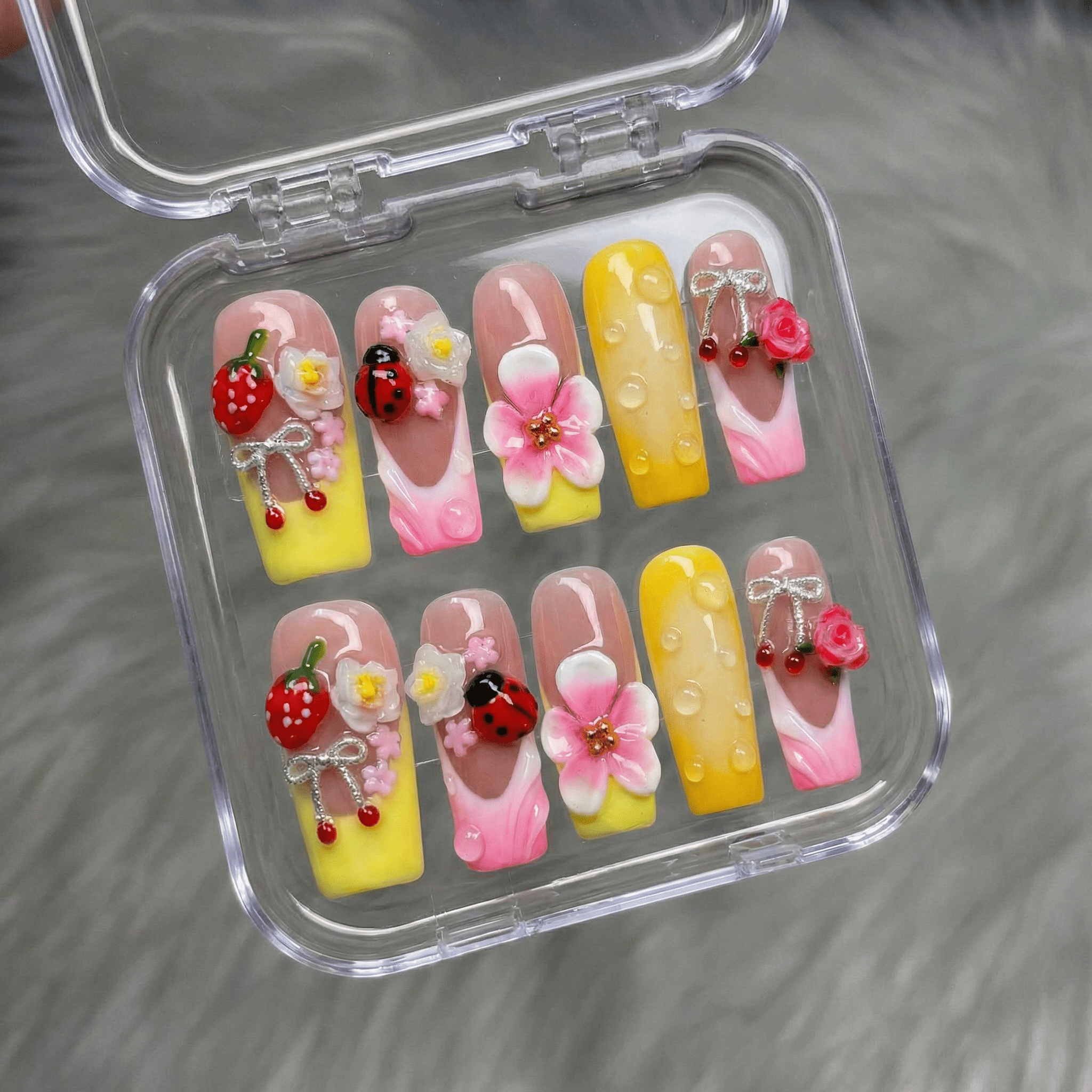 Berry Blossom press-on nails worn on hand – square shape by Handora