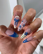Berry Bows press-on nails – hand-painted reusable gel set by Handora