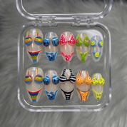 Bikini Summer press-on nails worn on hand – almond shape by Handora