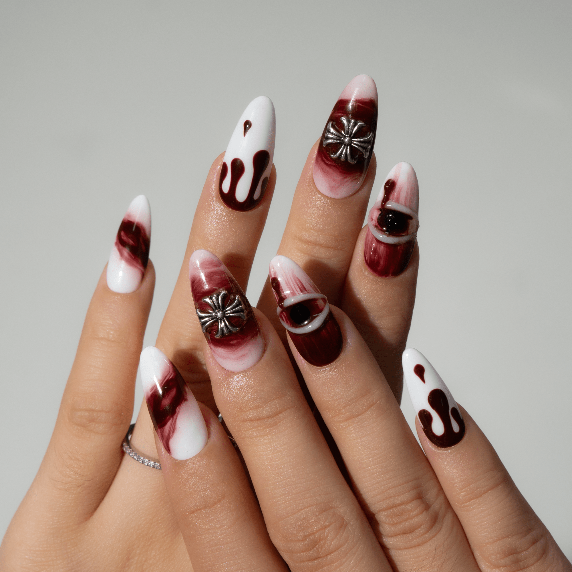 Bloody Night press-on nails worn on hand – almond shape by Handora