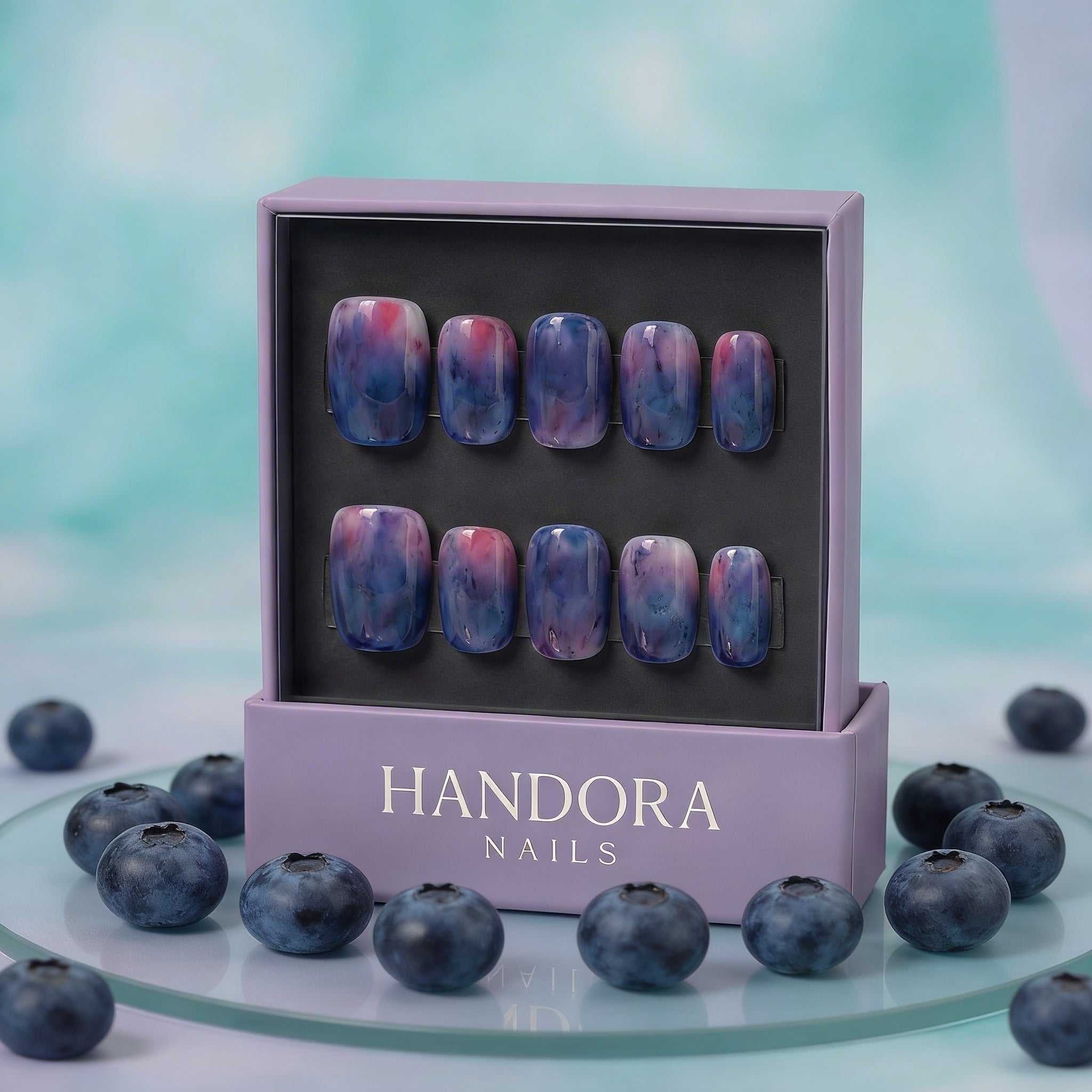 Blueberry Mist press-on nails worn on hand – almond shape by Handora