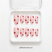 Blush Crush almond press-on nails – design close-up by Handora