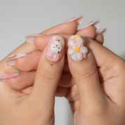 Bunny Garden oval press-on nails – design close-up by Handora