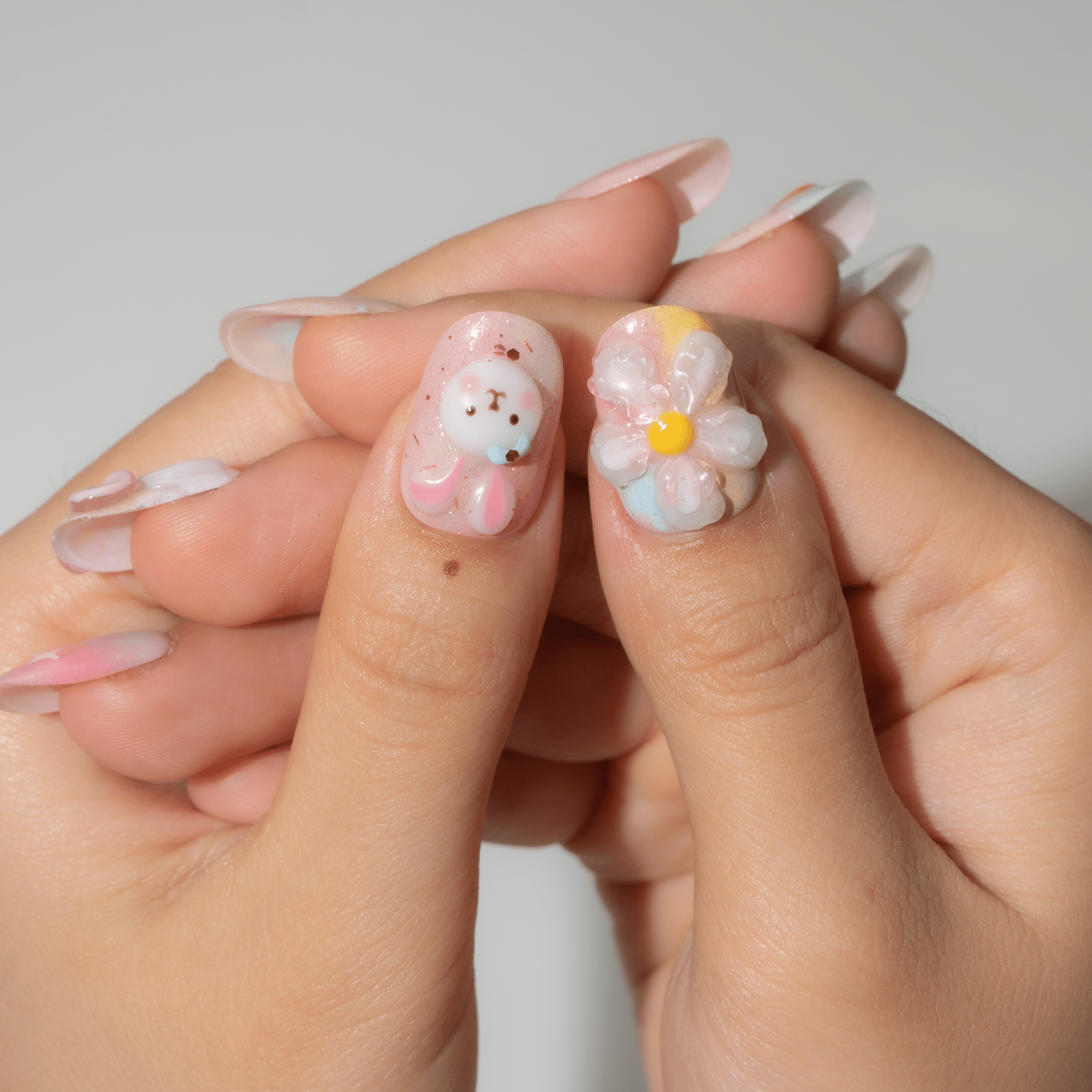 Bunny Garden oval press-on nails – design close-up by Handora