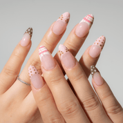 Candy Mix press-on nails worn on hand – almond shape by Handora
