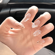 Celestial Bloom press-on nails worn on hand – almond shape by Handora