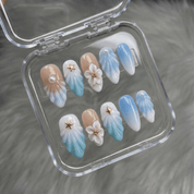 Celestial Tide press-on nails worn on hand – almond shape by Handora