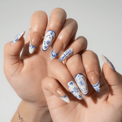 Ceramic Bloom press-on nails worn on hand – almond shape by Handora