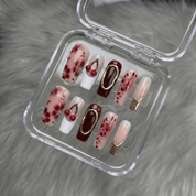 Cherry Crimson press-on nails worn on hand – coffin shape by Handora