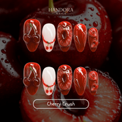 Cherry Crush press-on nails – design close-up by Handora