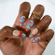 Cherry Denim press-on nails worn on hand – almond shape by Handora