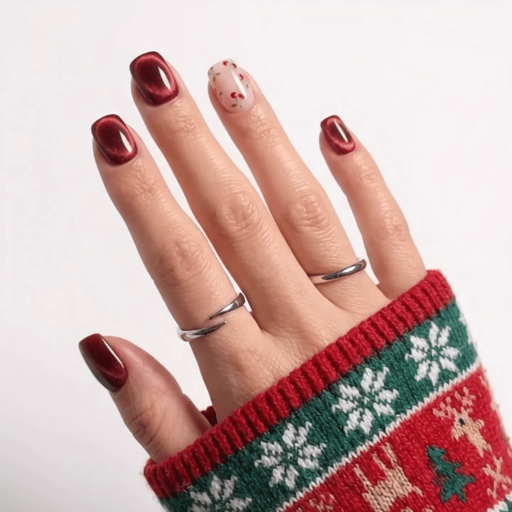 Cherry Glow Christmas press-on nails - moving hand by Handora Nails