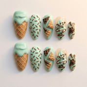 Choco Mint press-on nails worn on hand – almond shape by Handora