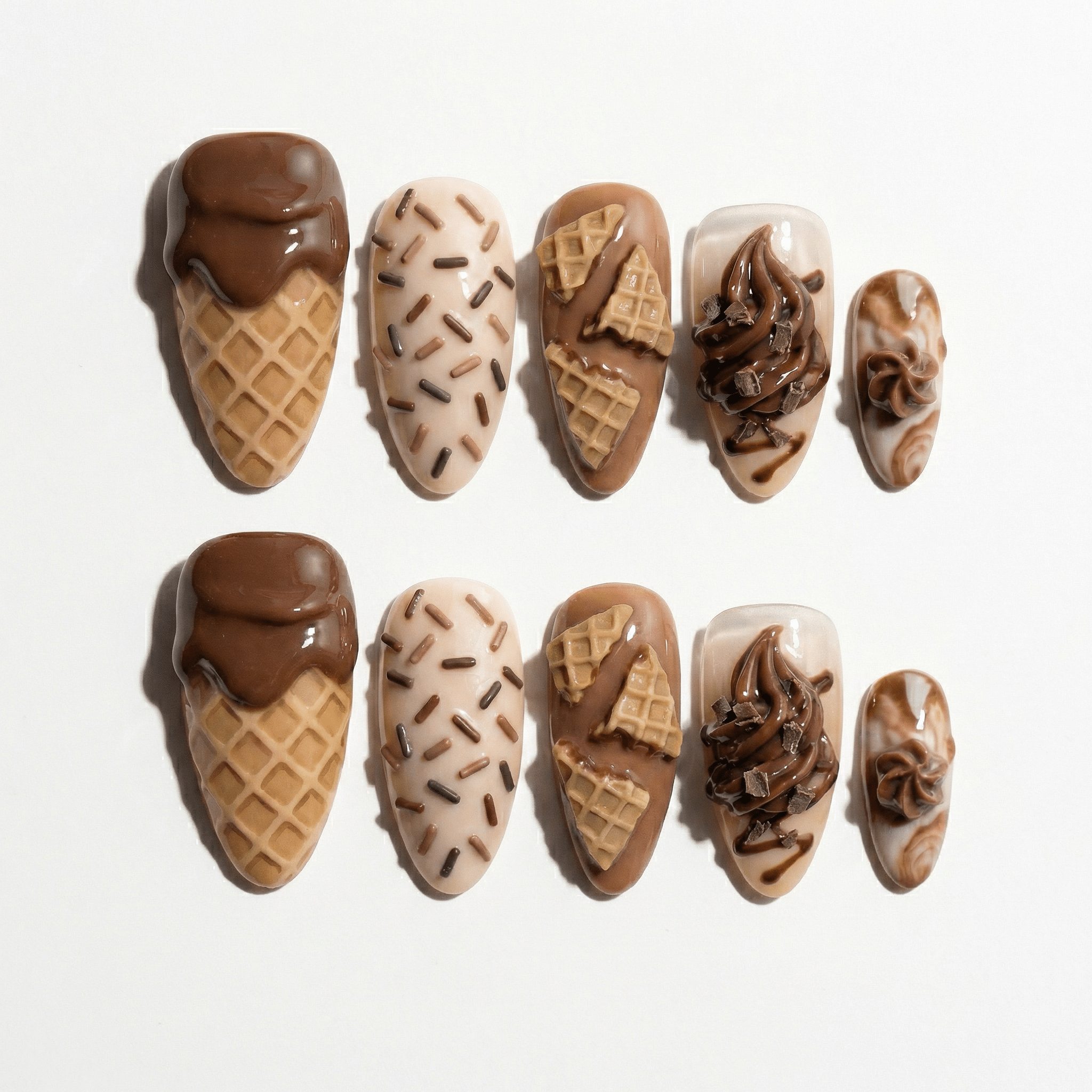Choco Swirl press-on nails worn on hand – almond shape by Handora