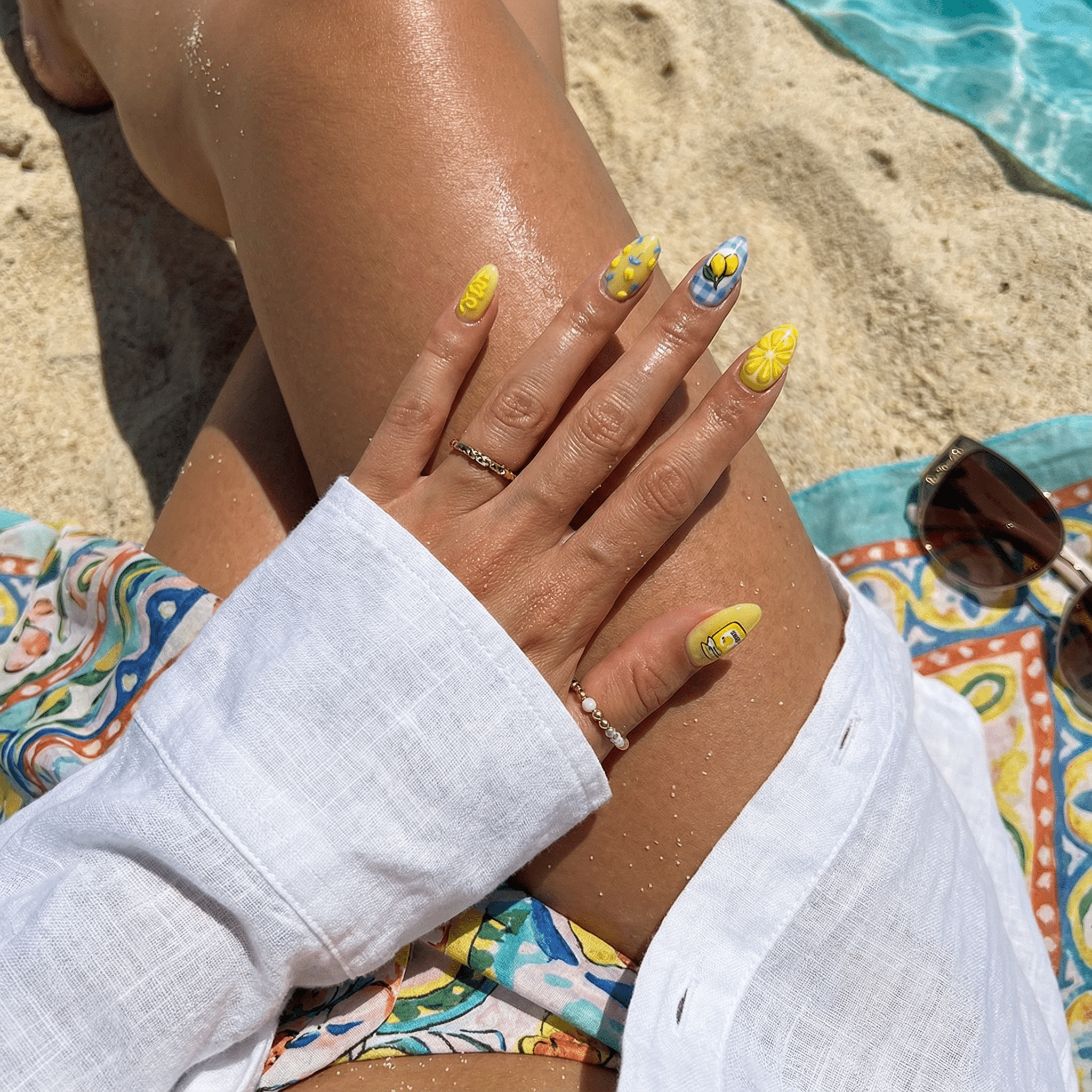 Citrus Berry press-on nails worn on hand – almond shape by Handora