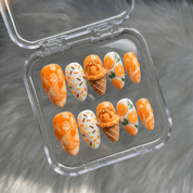 Citrus Sundae press-on nails worn on hand – almond shape by Handora