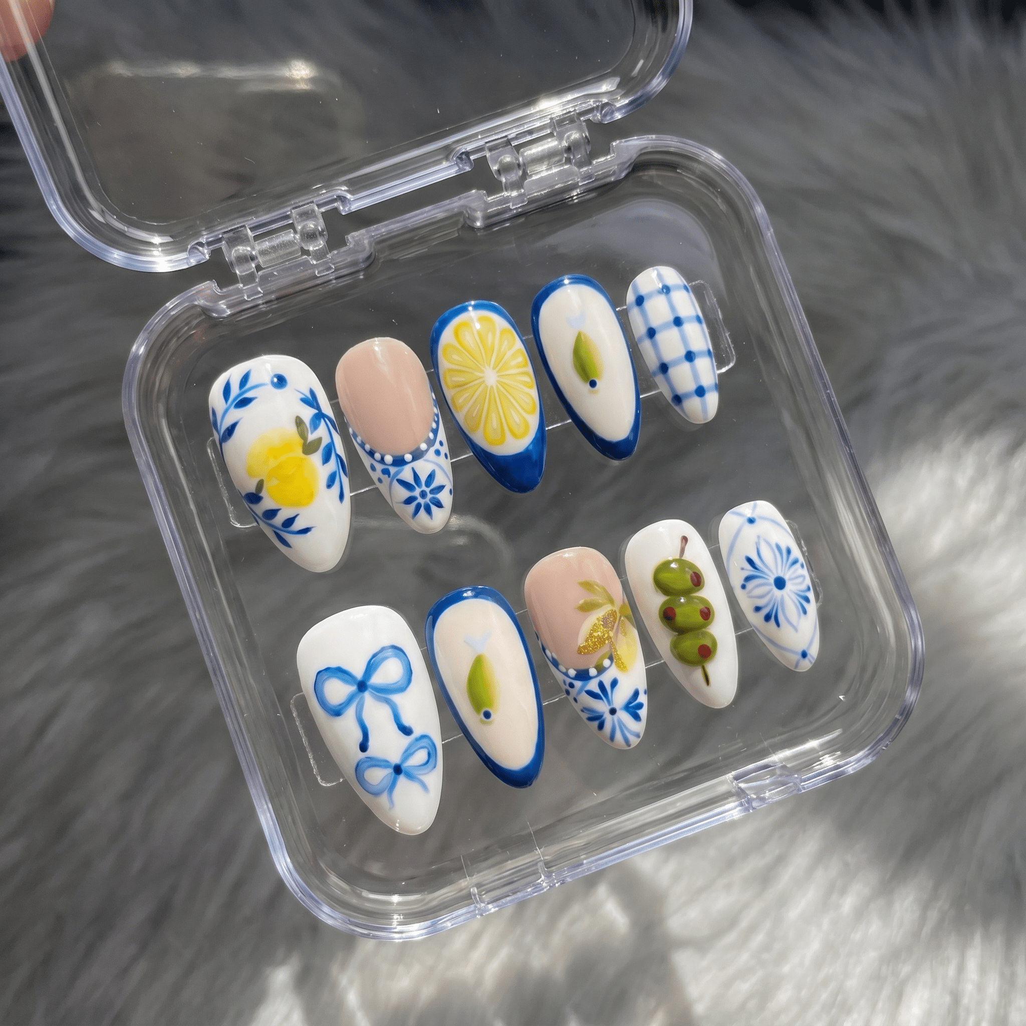 Citrus Tile press-on nails worn on hand – almond shape by Handora