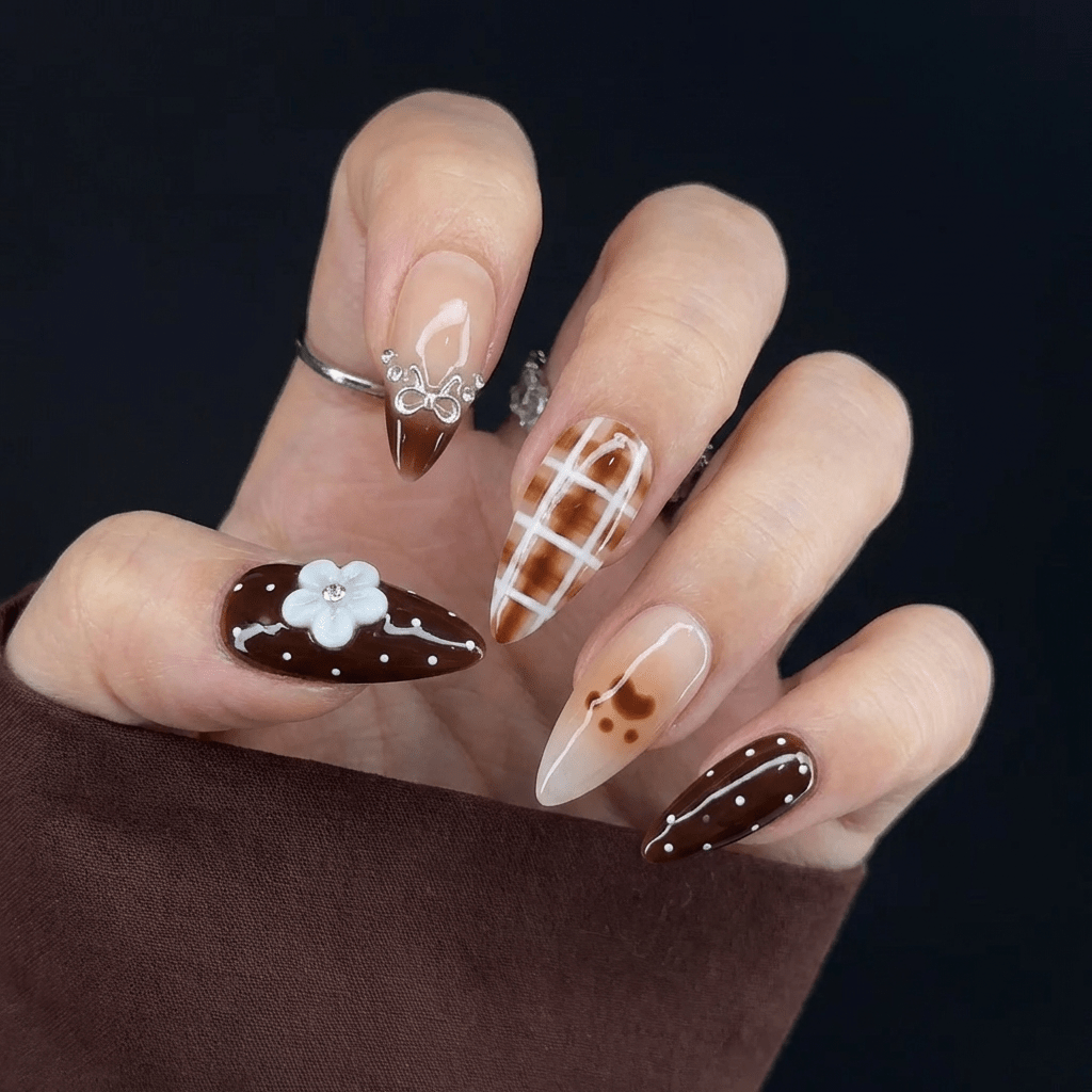 Cocoa Kawaii press-on nails worn on hand – almond shape by Handora