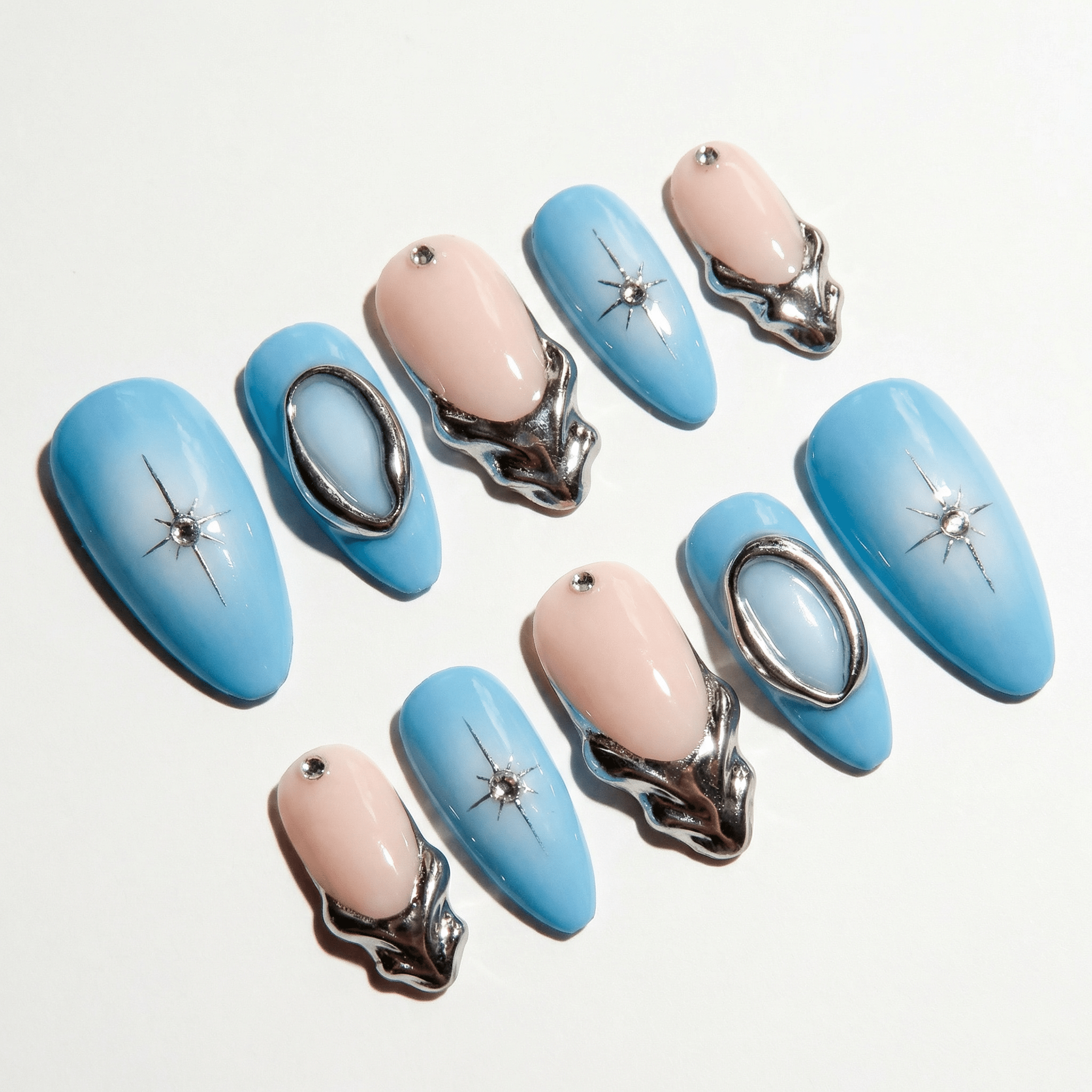 Cosmic Dew press-on nails worn on hand – almond shape by Handora