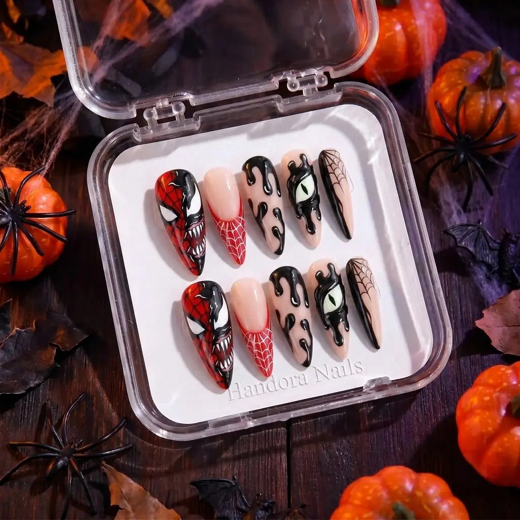 crimson-fang-a-split-snarling-face-red-webs-black-drips-and-a-green-slit-eye-on-long-stiletto-nails-handmade-by-handora-nails-halloween-2026-collection-2.webp