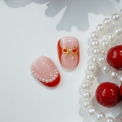 Crimson Joy press-on nails worn on hand – square shape by Handora