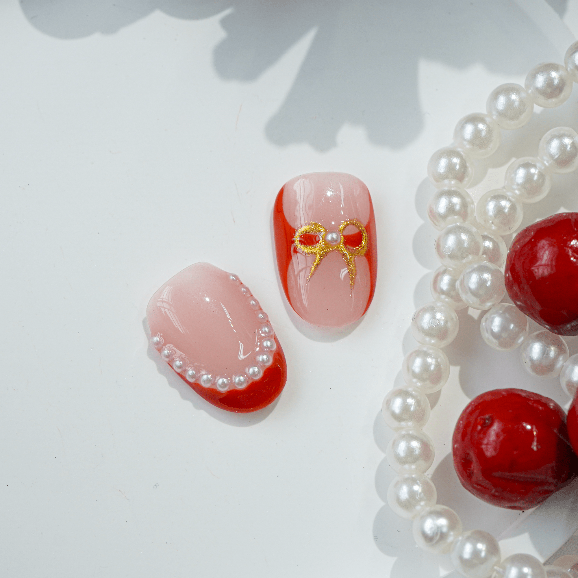 Crimson Joy press-on nails worn on hand – square shape by Handora