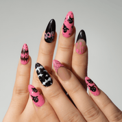 Cute Boo press-on nails worn on hand – almond shape by Handora