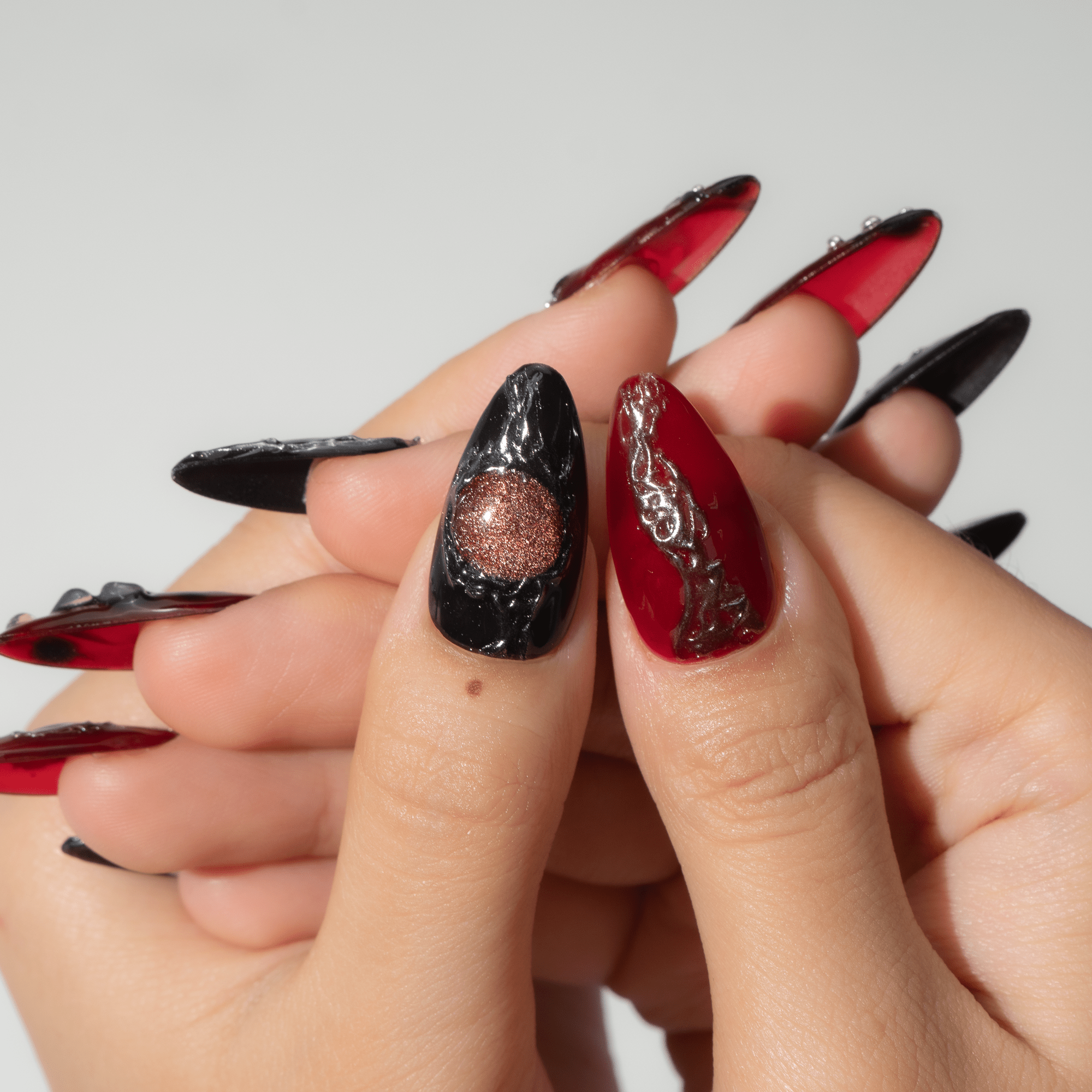Dark Ember almond press-on nails – design close-up by Handora