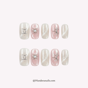 Dewy Pearl white cat eye press-on nails by Handora