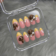 Doxie Treats press-on nails worn on hand – almond shape by Handora