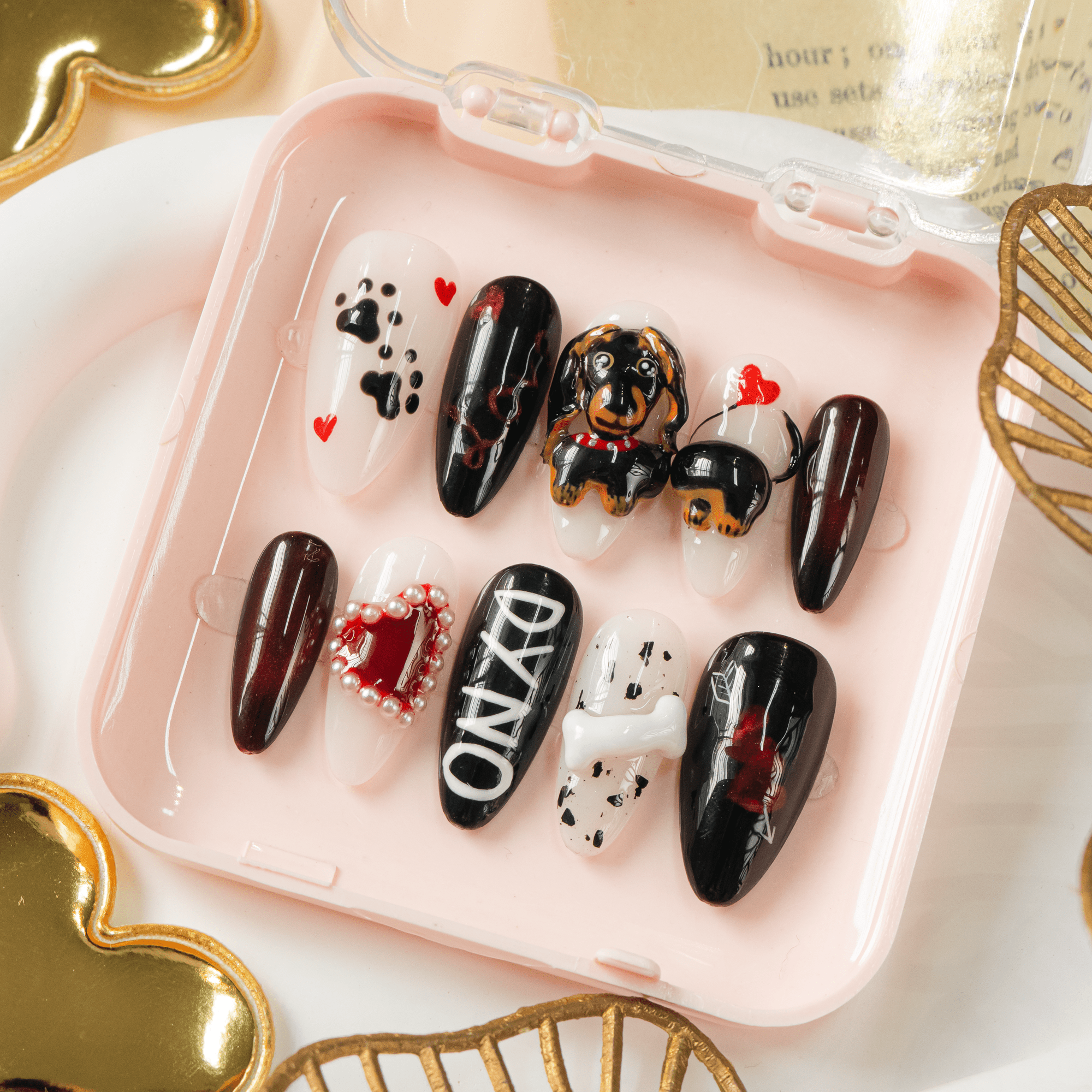 Dyno Pup press-on nails worn on hand – almond shape by Handora