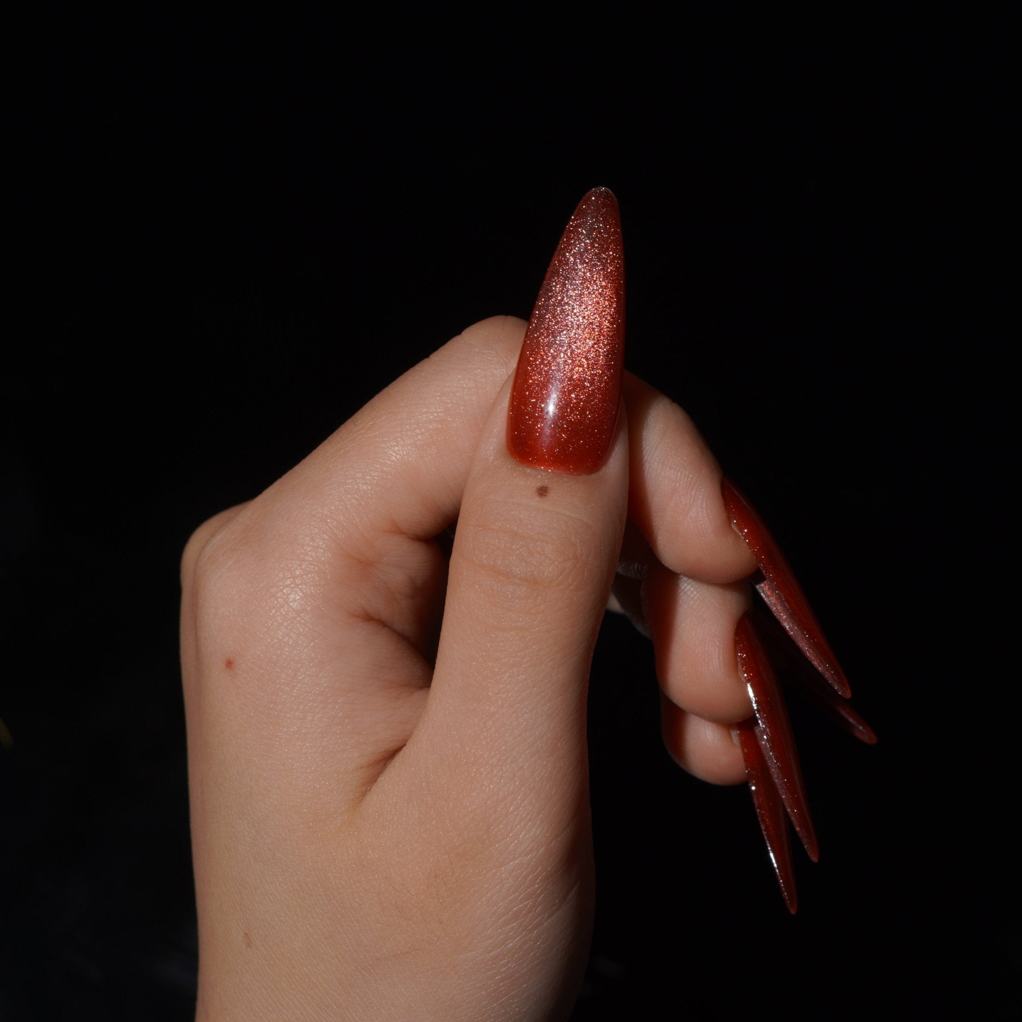 Emberglow almond press-on nails – design close-up by Handora