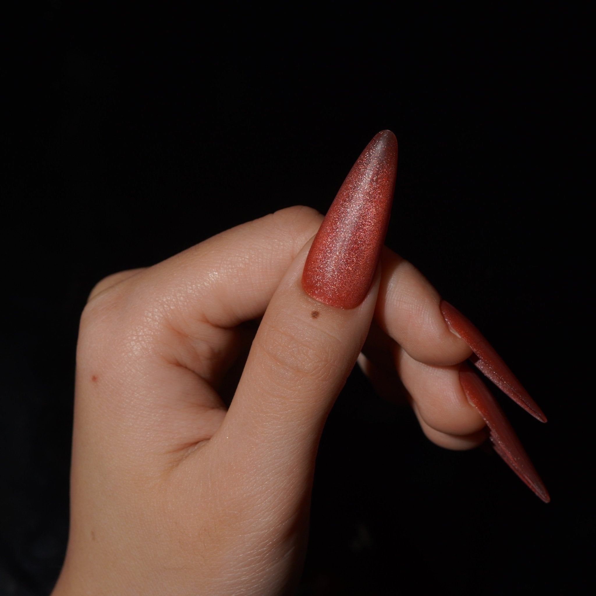 Emberveil almond press-on nails – design close-up by Handora