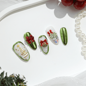 Emerald Noel almond press-on nails – design close-up by Handora