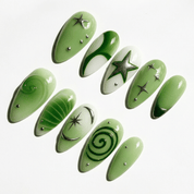 Emerald Star press-on nails worn on hand – almond shape by Handora