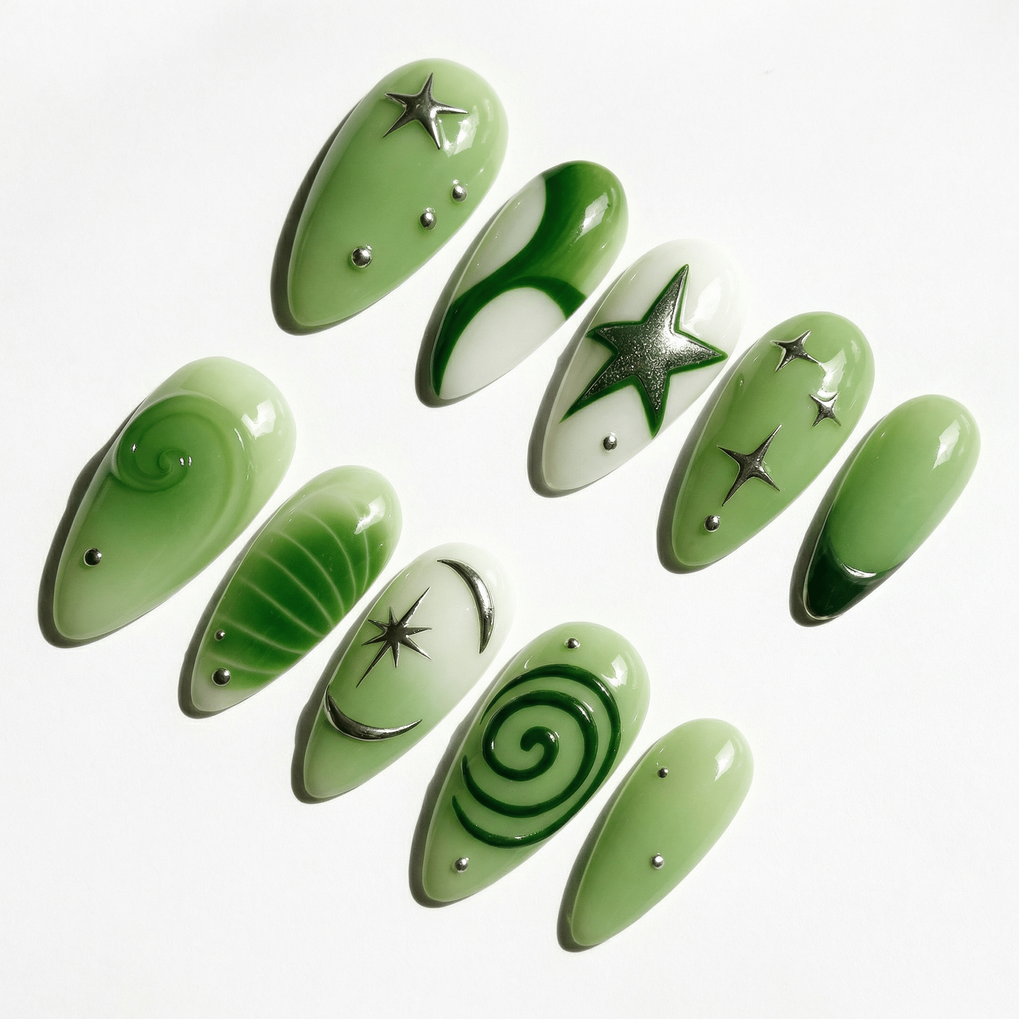 Emerald Star press-on nails worn on hand – almond shape by Handora