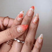 Eternal Bloom press-on nails worn on hand – almond shape by Handora