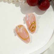 Ethereal Chrome press-on nails worn on hand – almond shape by Handora