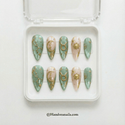 Ethereal Taurus press-on nails worn on hand – almond shape by Handora