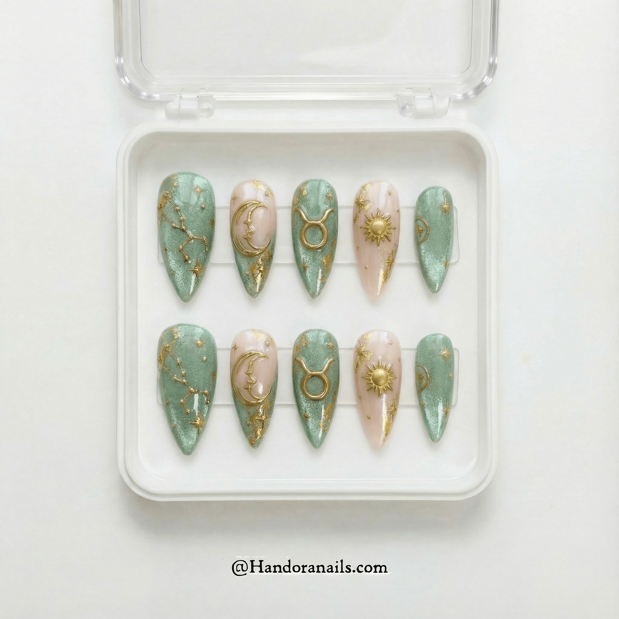 Ethereal Taurus press-on nails worn on hand – almond shape by Handora