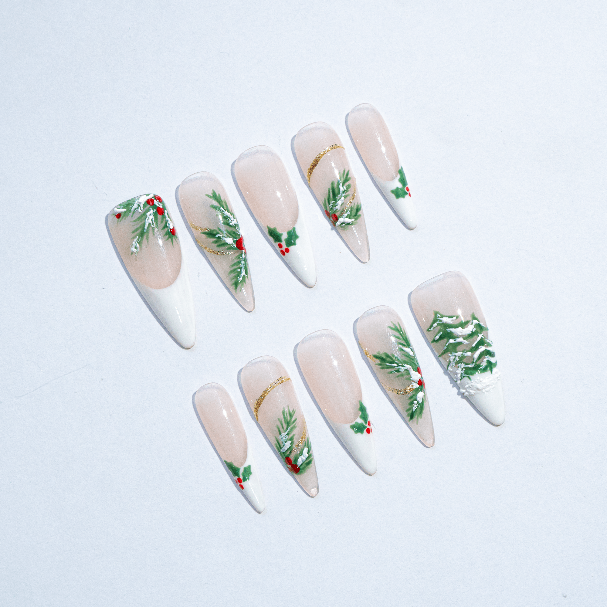 Festive Holly almond press-on nails – design close-up by Handora