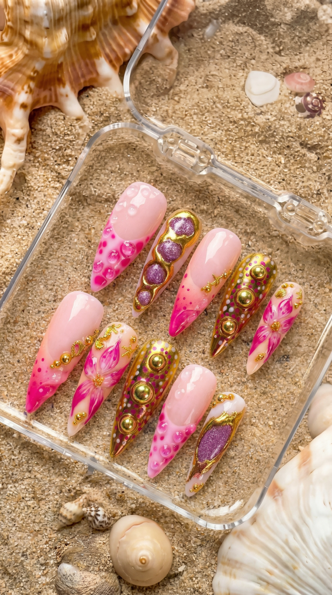 Floral Bijoux press-on nails worn on hand – almond shape by Handora