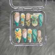 Floral Butterfly press-on nails worn on hand – almond shape by Handora