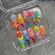 Floral Carnival press-on nails worn on hand – almond shape by Handora
