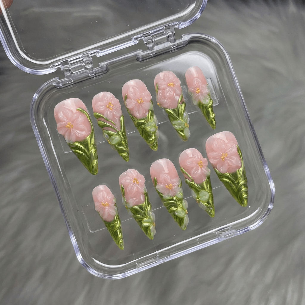 Floral Ceramic press-on nails worn on hand – stiletto shape by Handora
