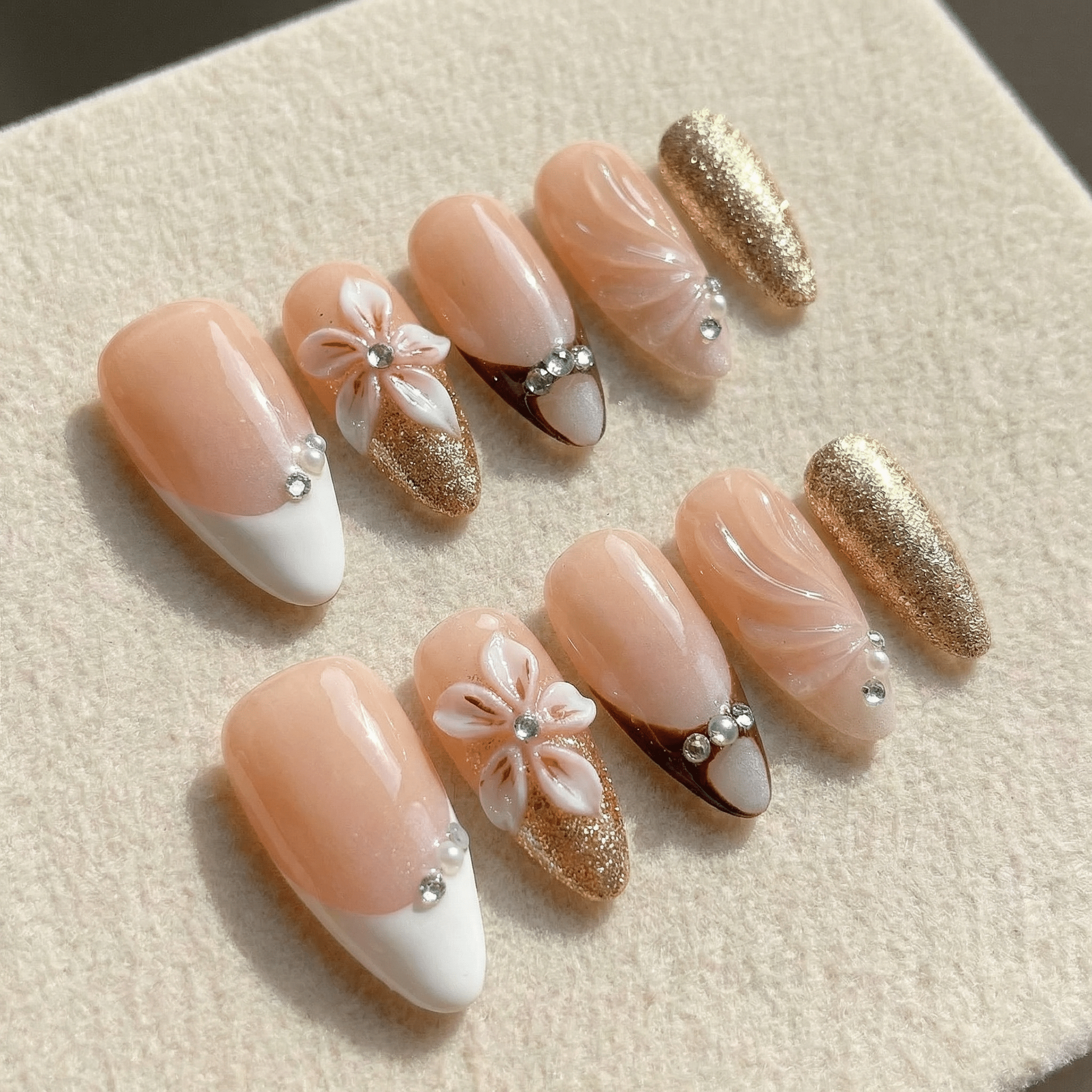Floral Elegance press-on nails worn on hand – almond shape by Handora