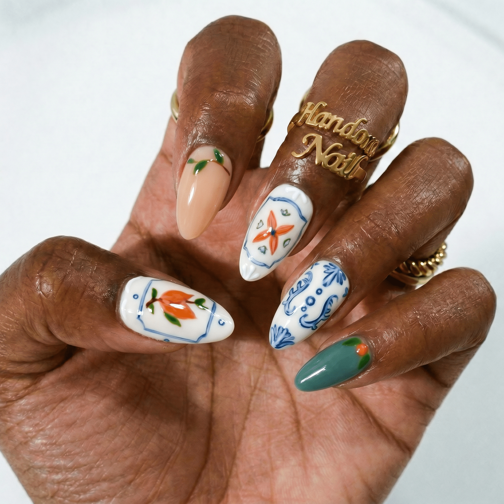 Floral Majolica press-on nails – hand-painted reusable gel set by Handora
