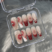 Floral Marble press-on nails worn on hand – almond shape by Handora