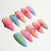 Floral Pastel press-on nails worn on hand – almond shape by Handora
