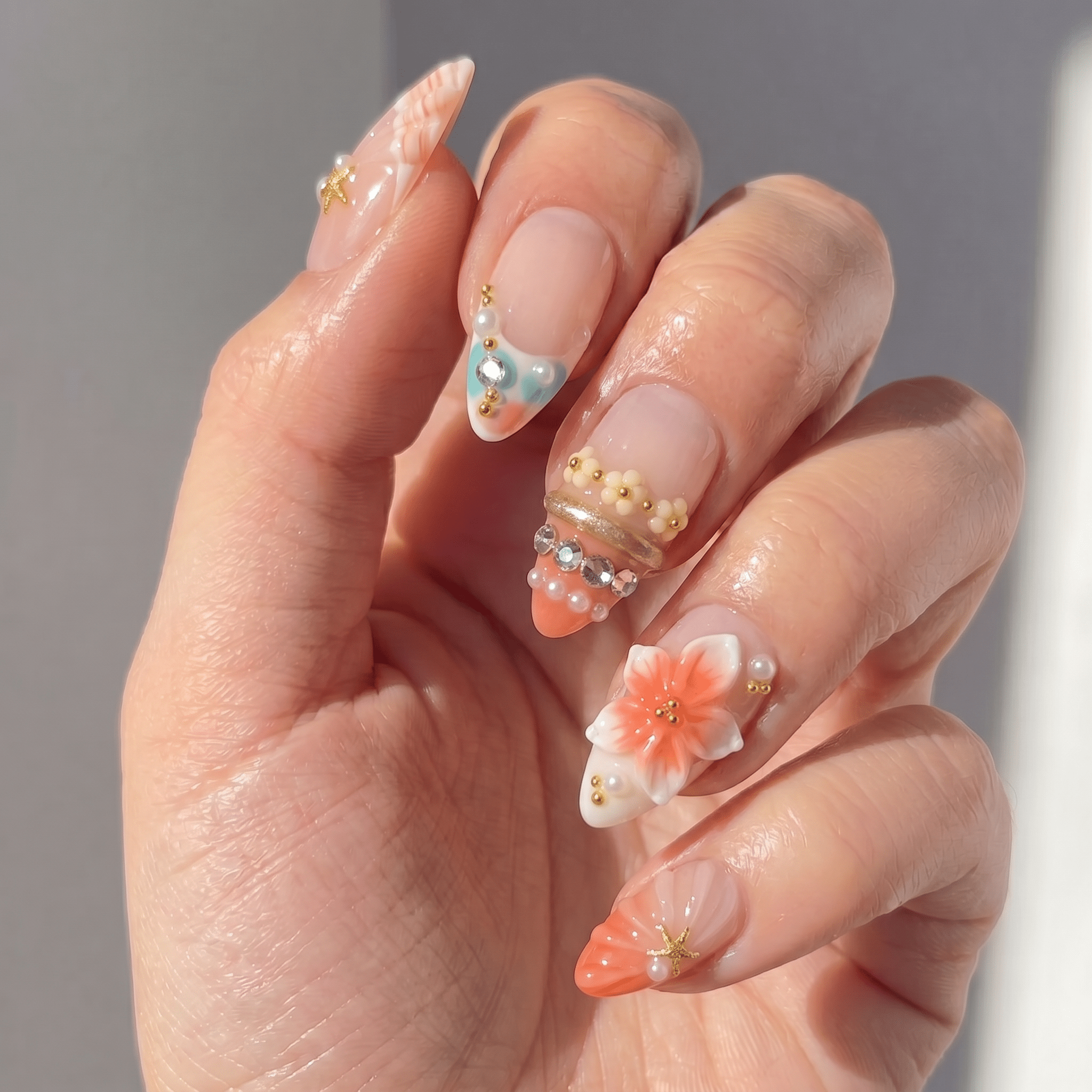 Floral Serenity press-on nails worn on hand – almond shape by Handora
